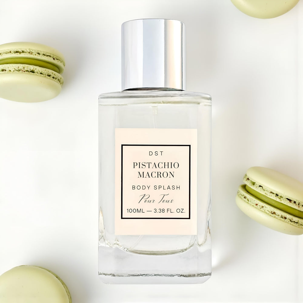 Pistachio Macron body splash bottle with macarons on a white background