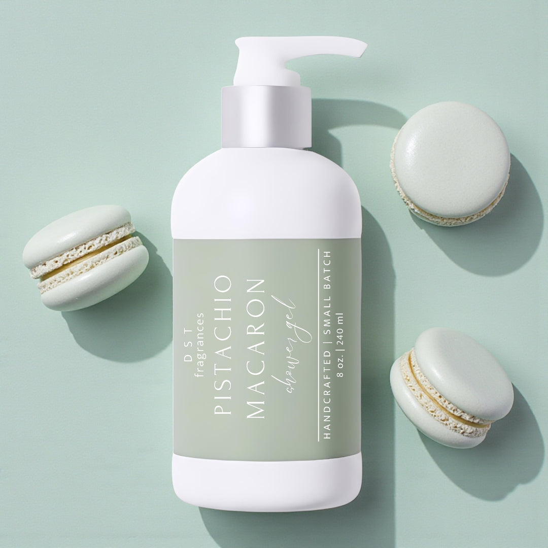 240ml bottle of Pistachio Macaron scented shower gel by DST Fragrances against a mint green background with pistachio french macarons.