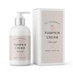 A bottle of DST Fragrances Pumpkin Cream Shower Gel next to its retail box, both featuring a neutral beige label on a white bottle and box, set against a clean white background.