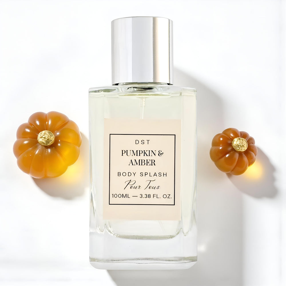 Perfume bottle labeled 'Pumpkin & Amber' with decorative pumpkins on a white background