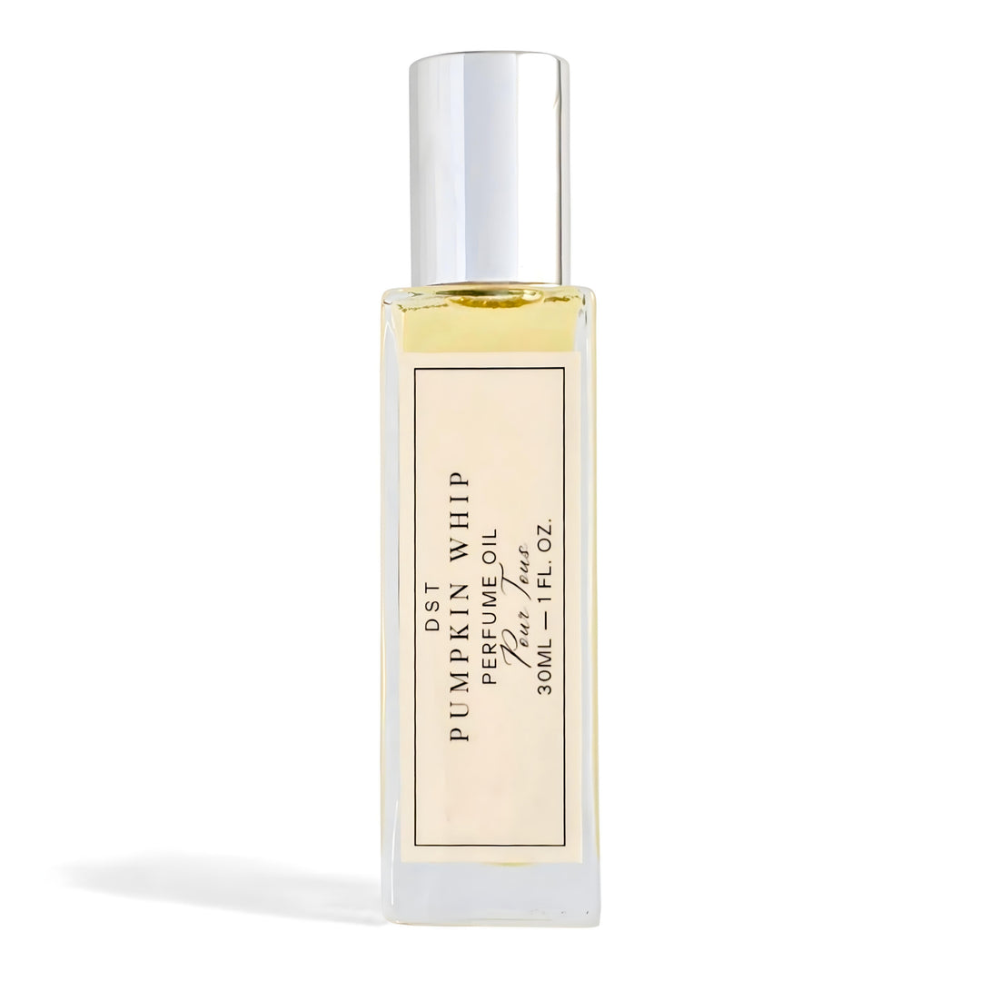 Perfume oil bottle with a gold label on a white background