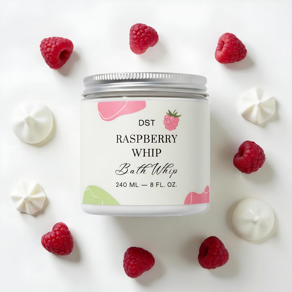 Bath whip container labeled 'Raspberry Whip' with raspberries and cream on a white background