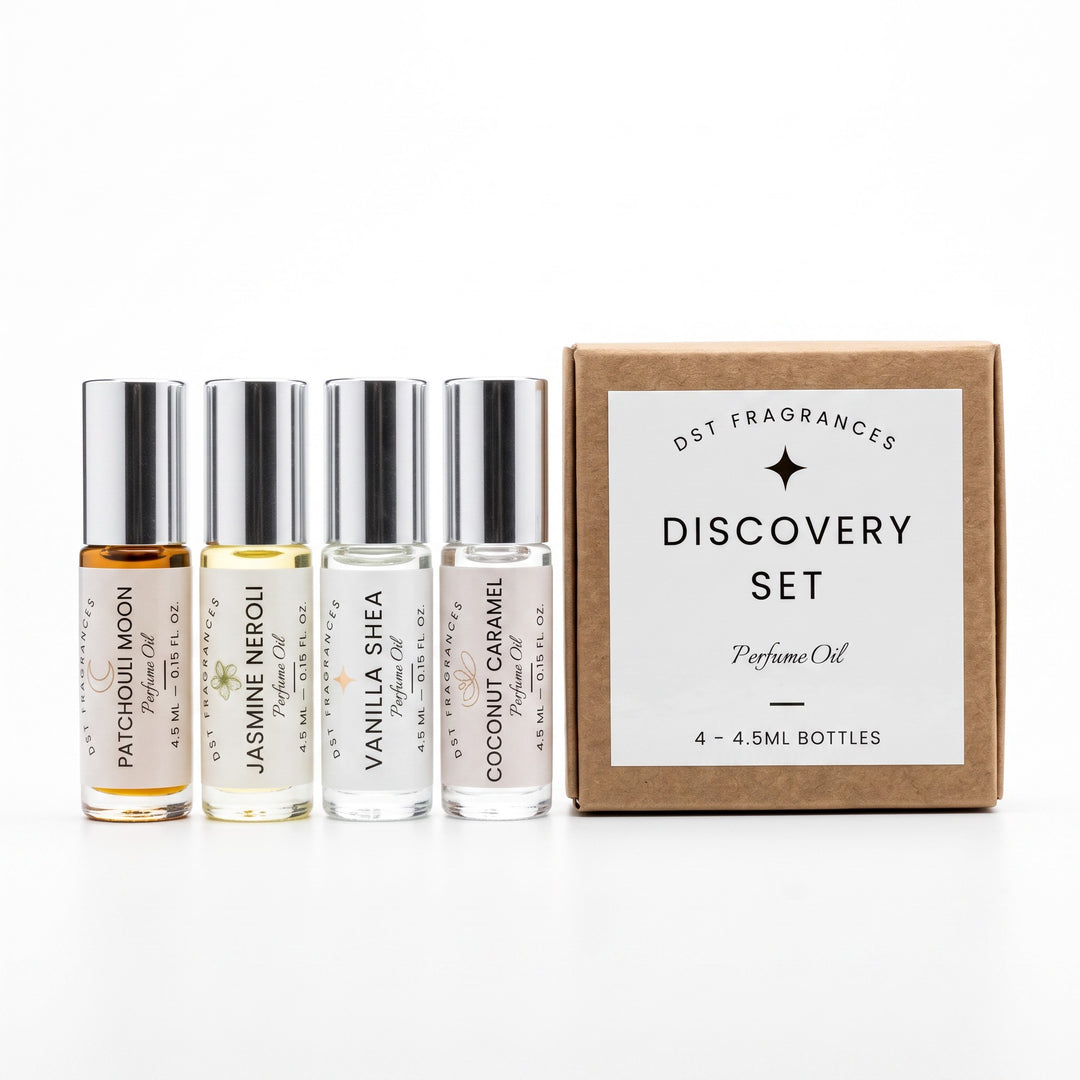 4 4.5ml eau de parfum spray bottles by DST Fragrances and the box they are packaged in. 