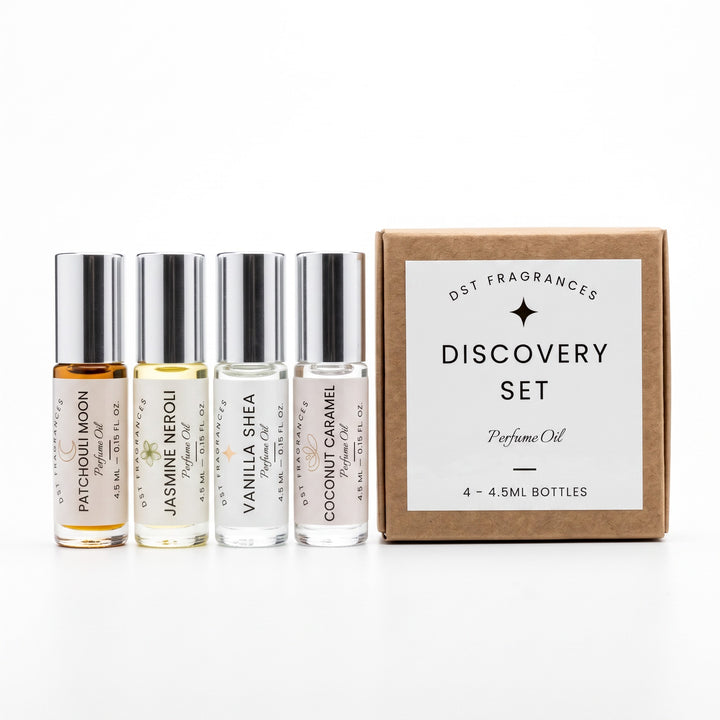 4 4.5ml eau de parfum spray bottles by DST Fragrances and the box they are packaged in. 
