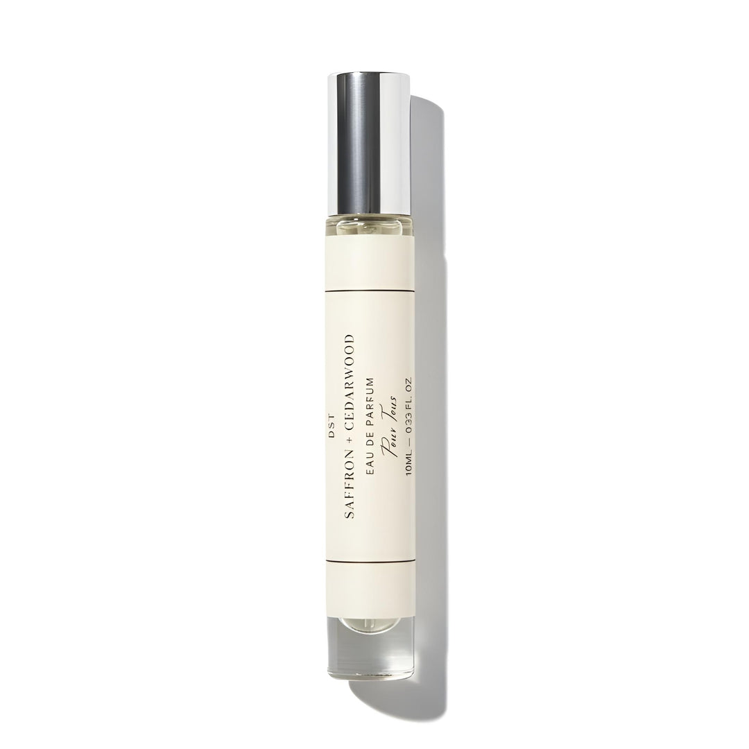 Perfume bottle with silver cap on a white background
