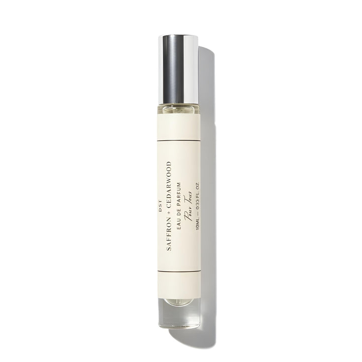 Perfume bottle with silver cap on a white background