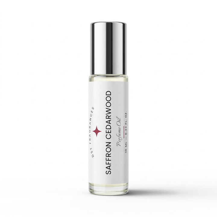 A clear glass rollerball bottle of Saffron Cedarwood prelude oil with a reflective silver cap and a white label, shown on a clean white background.