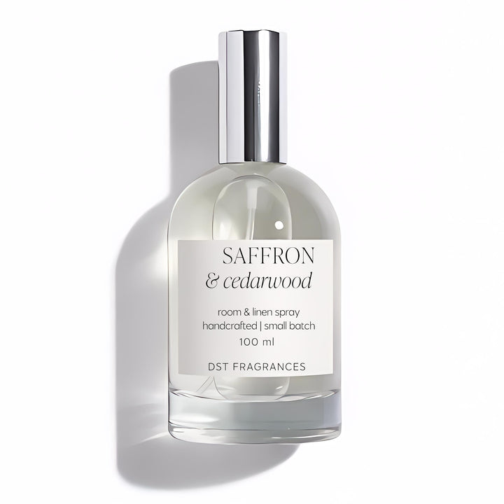 100ml bottle of Saffron Cedarwood Room Linen Spray by DST Fragrances against a white background.