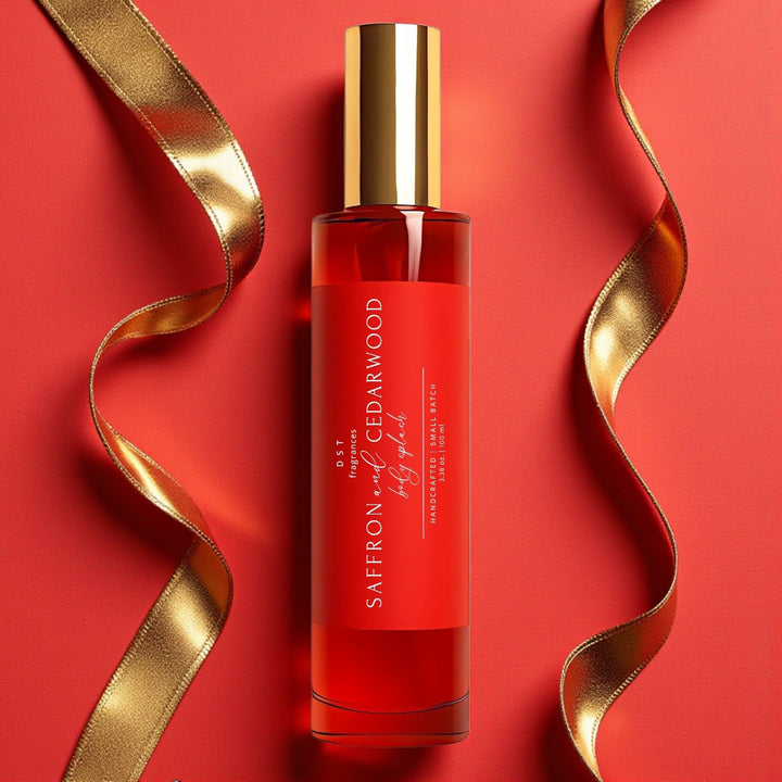 100ml bottle of Saffron & Cedarwood scented Room & Linen Spray against a red background with 2 gold ribbons.