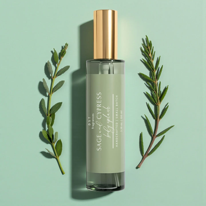 Fragrance bottle labeled 'Sage & Cypress' with green leaves on a light green background