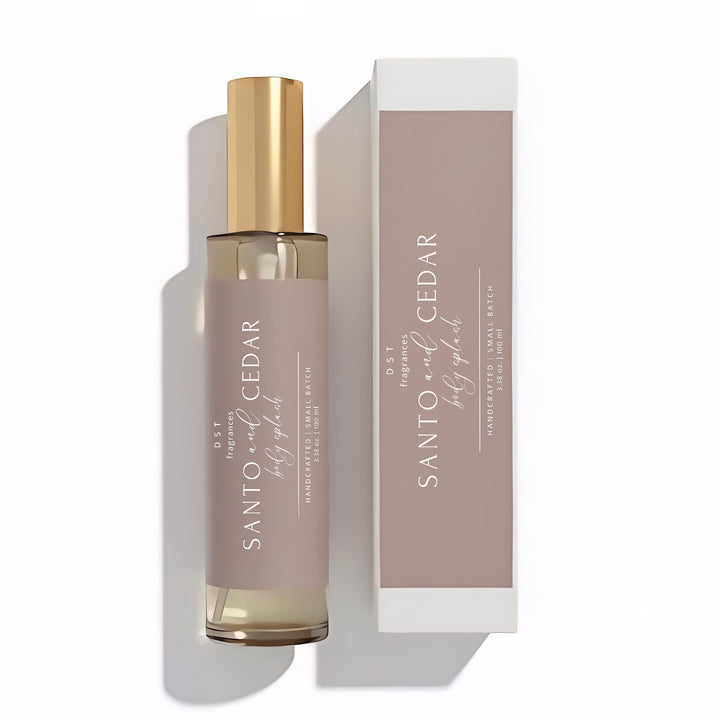 100ml bottle of Santo & Cedar scented body splash and its box by DST Fragrances lying flat on a white background.
