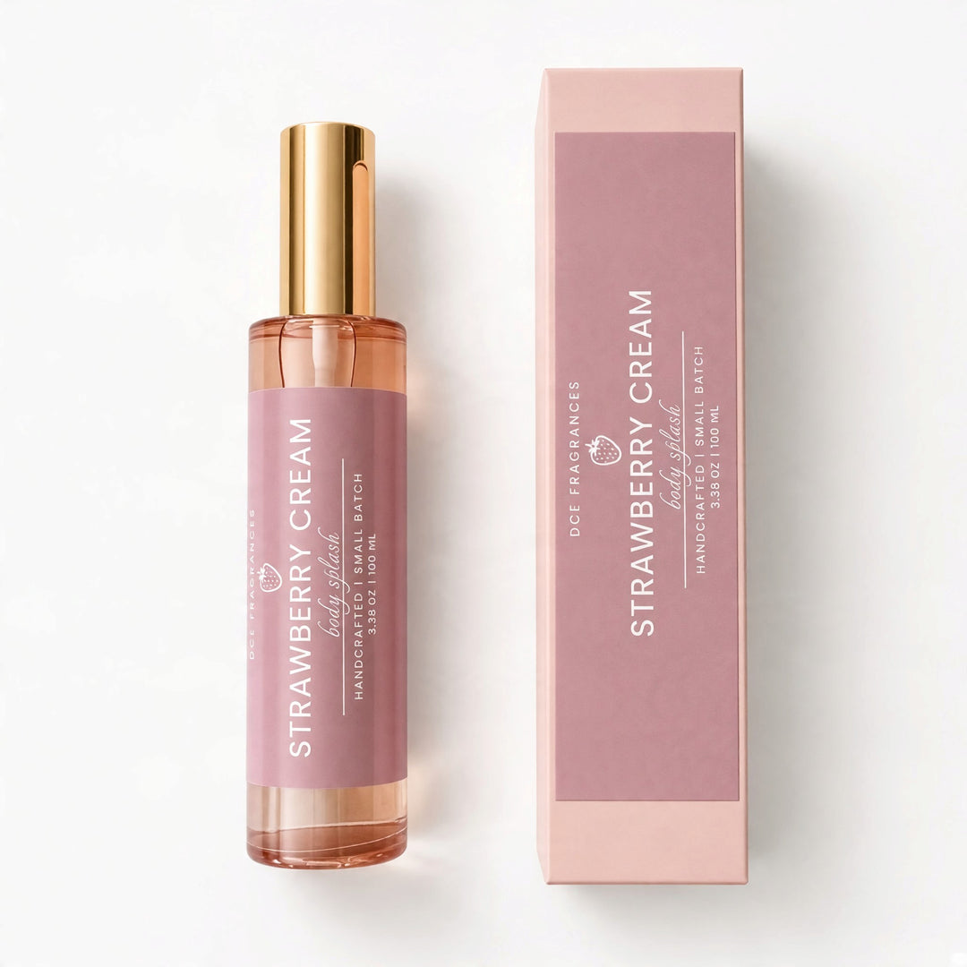 A handcrafted small batch hand-poured rollerball bottle of Strawberry Cream fragrance by Dst Fragrances, shown next to its matching pink packaging box on a clean white background.