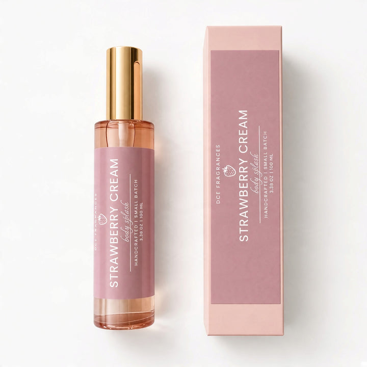 A handcrafted small batch hand-poured rollerball bottle of Strawberry Cream fragrance by Dst Fragrances, shown next to its matching pink packaging box on a clean white background.