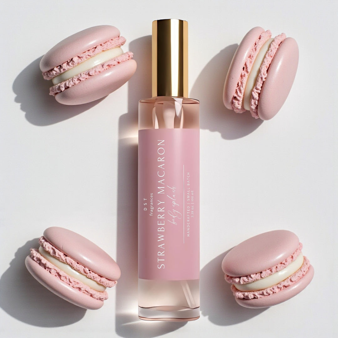 100ml bottle of Strawberry Macaron scented body splash by DST Fragrances against a white background with pink french macarons.