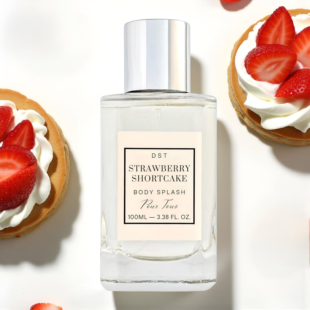 Perfume bottle labeled 'Strawberry Shortcake' with strawberry shortcake desserts in the background