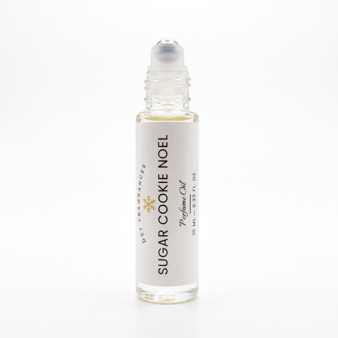 10ml bottle of Sugar Cookie Noel perfume oil by DST Fragrances against a white background. The top is removed to show rollerball dispenser.