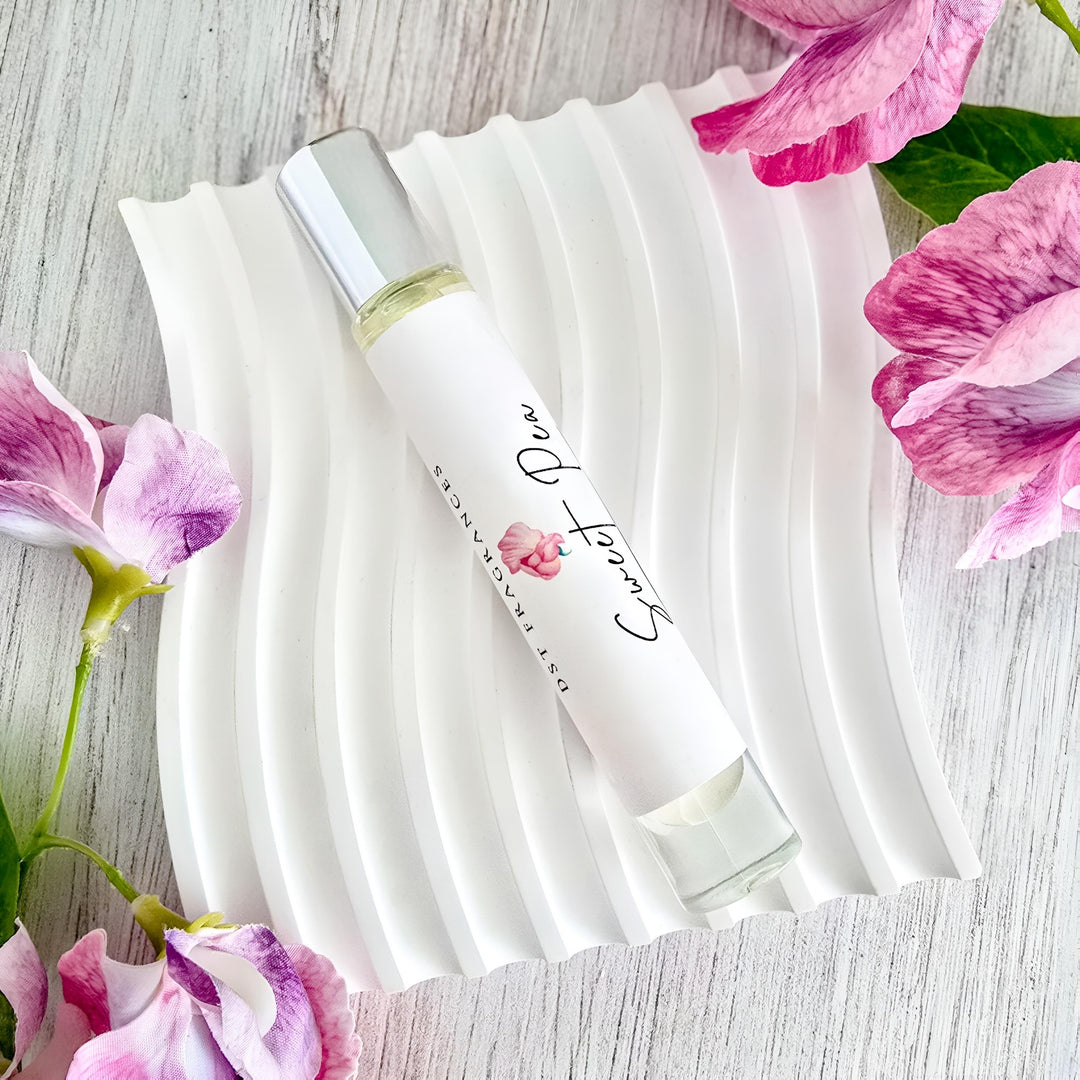 10ml bottle of Sweet Pea perfume oil against a grey background. 
