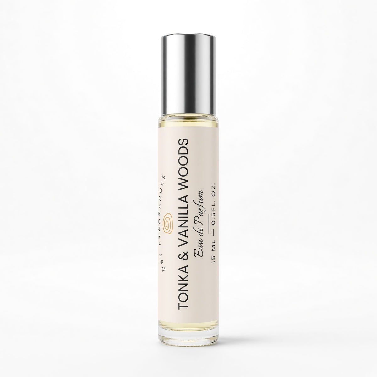 A 15 ml glass rollerball perfume bottle with a silver cap, featuring a cream-colored label with black text that reads 'TONKA & VANILLA WOODS'