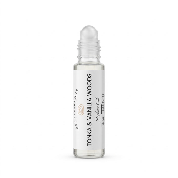A clear glass rollerball bottle of Tonka &amp; Vanilla Woods perfume oil with a white label, shown on a clean white background.