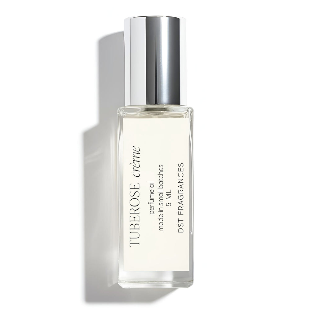 5ml roll on bottle of Tuberose Creme scented Perfume Oil by DST Fragrances against a white background.