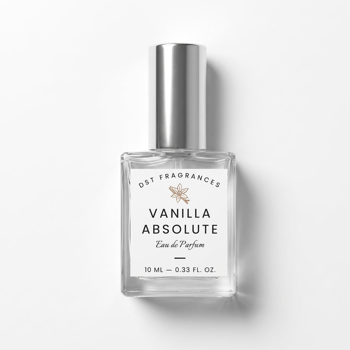 A 10 ml clear glass bottle of DST Fragrances Vanilla Absolute Eau de Parfum with a silver cap and white label, set against a clean white background with a soft shadow.