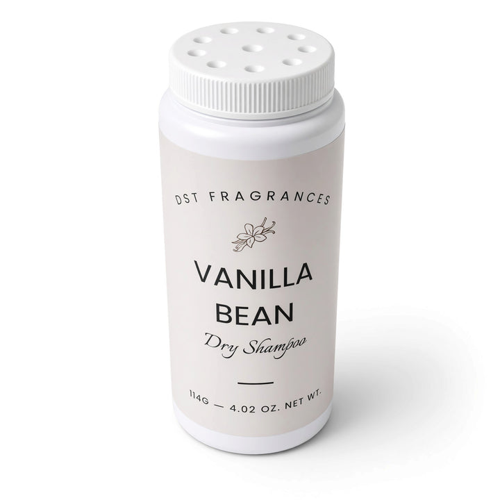 A white plastic bottle of DST Fragrances Vanilla Bean Dry Shampoo, featuring a white screw cap with ventilation holes and a clean white label with black text.