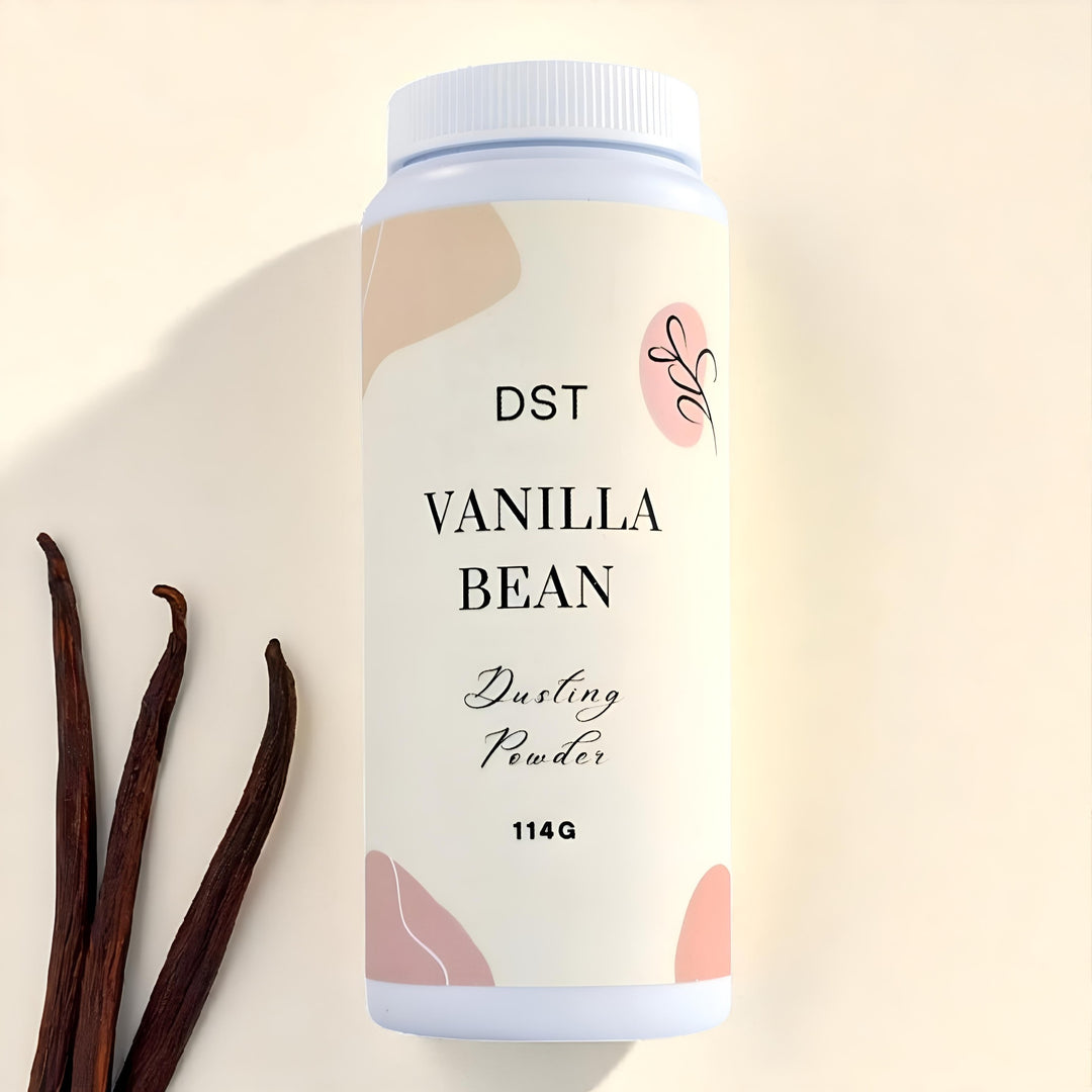 Vanilla bean dusting powder container with vanilla beans on a beige background