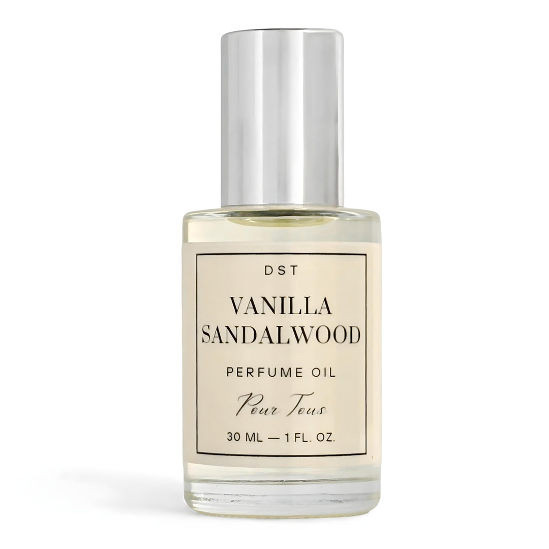 Vanilla Sandalwood perfume oil bottle on a dark slate surface with a light gray background