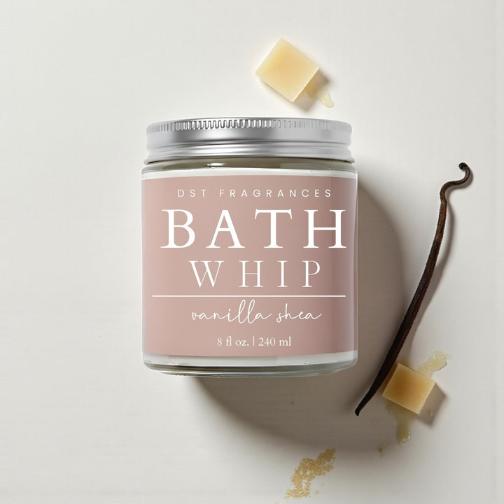 Vanilla Shea Bath Whip container with vanilla bean and shea butter on a light background