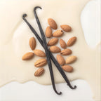 Two dark vanilla bean pods and several whole almonds arranged on a creamy off-white liquid background.