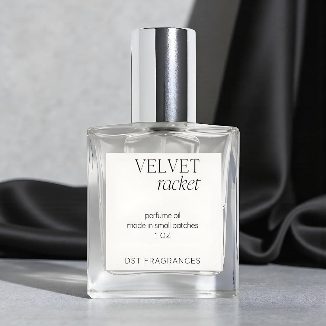 Perfume oil bottle labeled 'Velvet Racket' on a light gray background