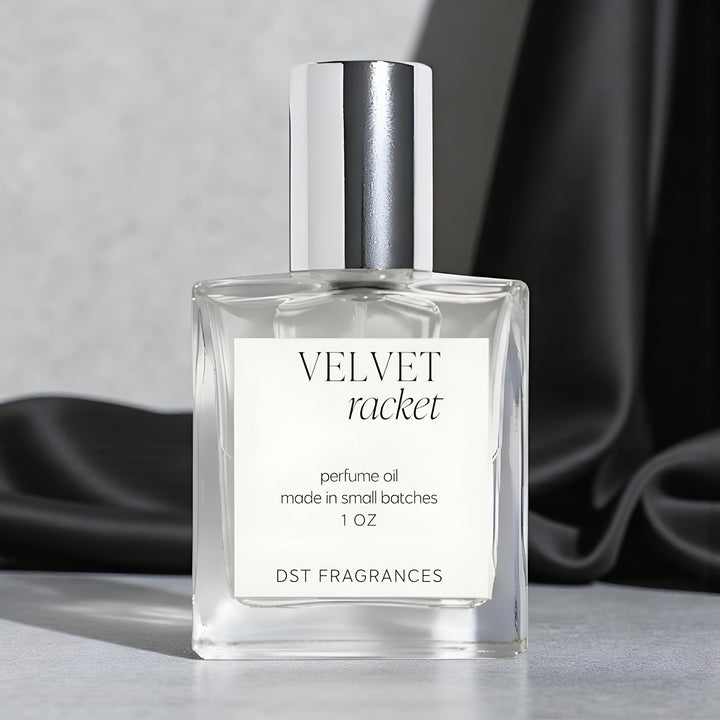 Perfume oil bottle labeled 'Velvet Racket' on a light gray background