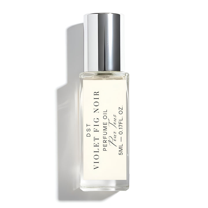 Perfume oil bottle labeled 'Violet Fig Noir' on a white background