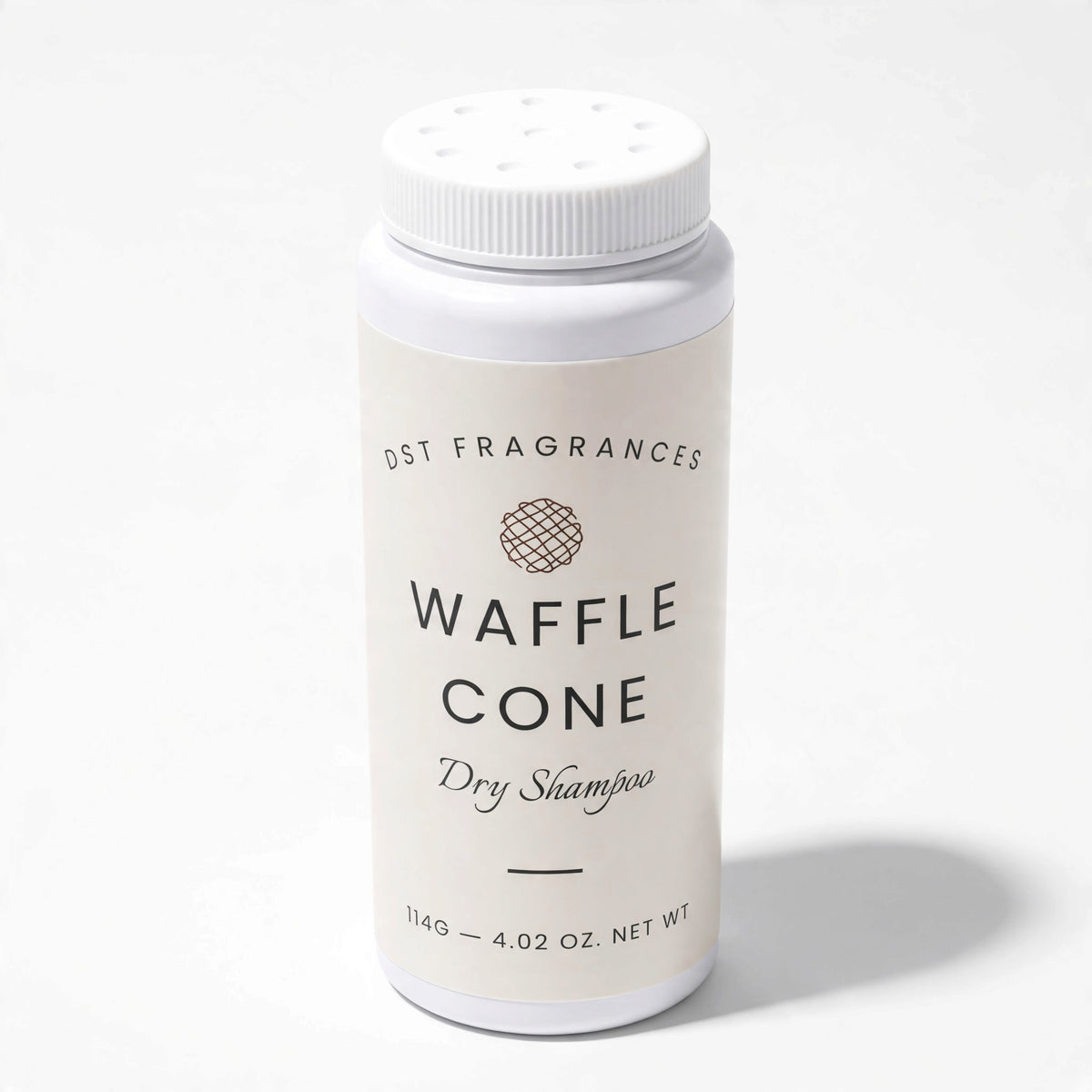 A white plastic bottle of Waffle Cone Dry Shampoo by Osm Fragrances, featuring a white label with black text and a small brown geometric logo, set against a plain white background.