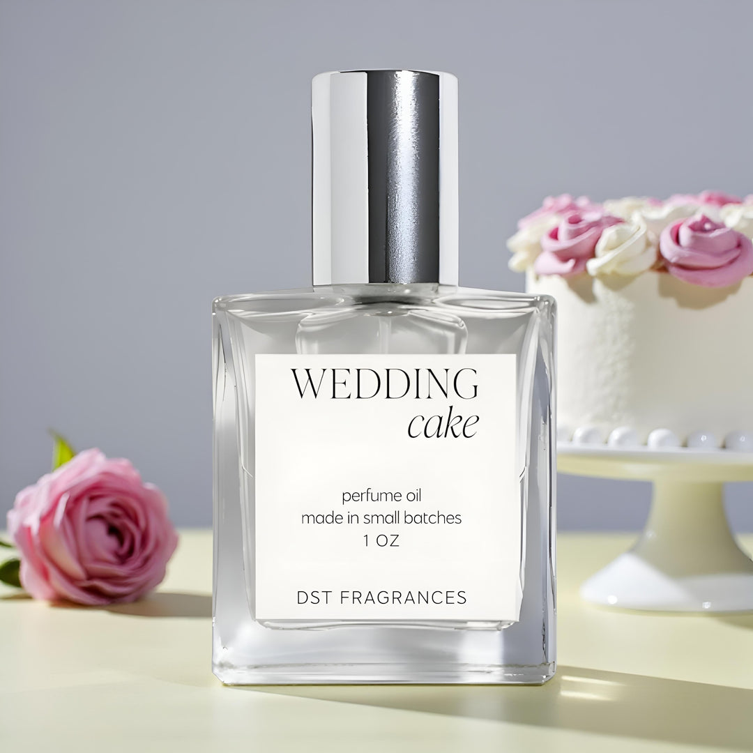 Perfume oil bottle labeled 'Wedding Cake' with a cake in the background
