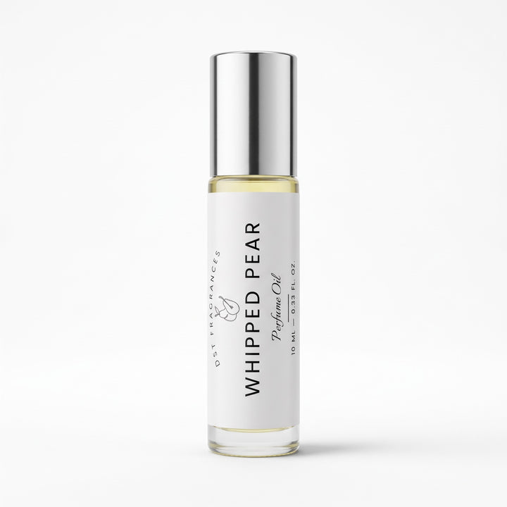 A 10 ml glass roller bottle of Whipped Pear Perfume Oil by DST Fragrances featuring a white label and a reflective silver cap, set against a clean white background.