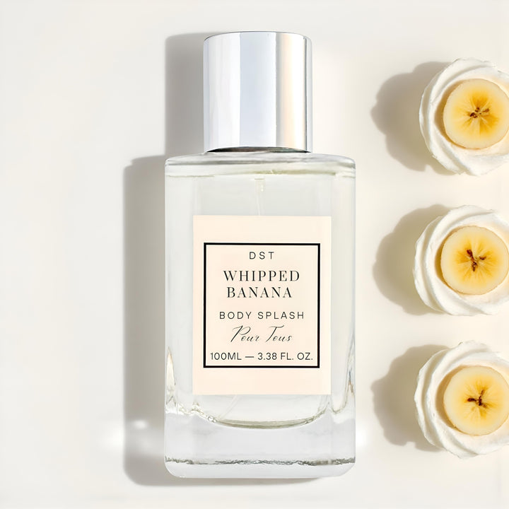 Body splash bottle labeled 'Whipped Banana' with banana slices on a light background