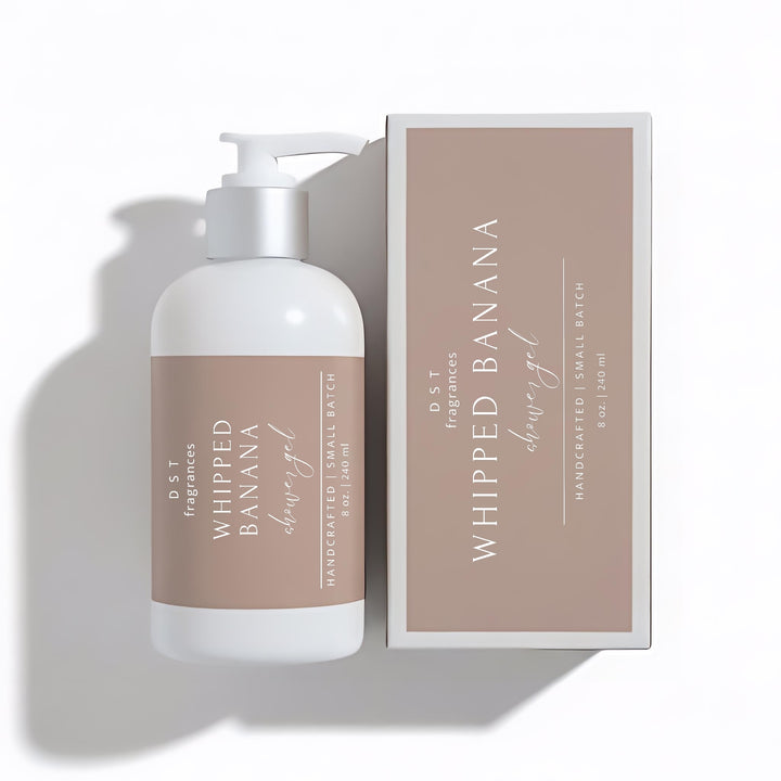 240ml bottle of Whipped Banana scented shower gel and its box by DST Fragrances against a white background.