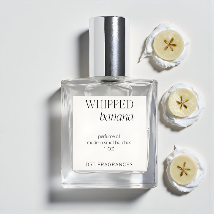 Perfume oil bottle labeled 'Whipped Banana' with banana slices on a white background