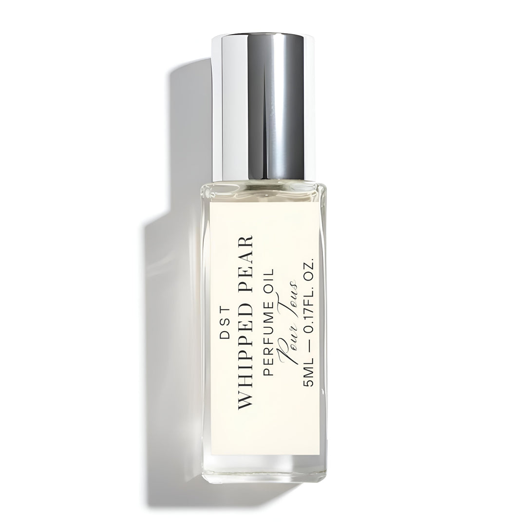 Perfume oil bottle labeled 'Whipped Pear' with a silver cap on a white background